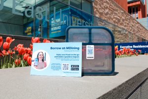 to-go box and with a post card in front with the fill it forward information